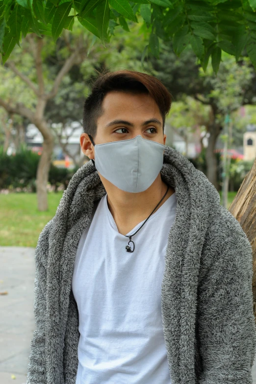 a man wearing a face mask on the street