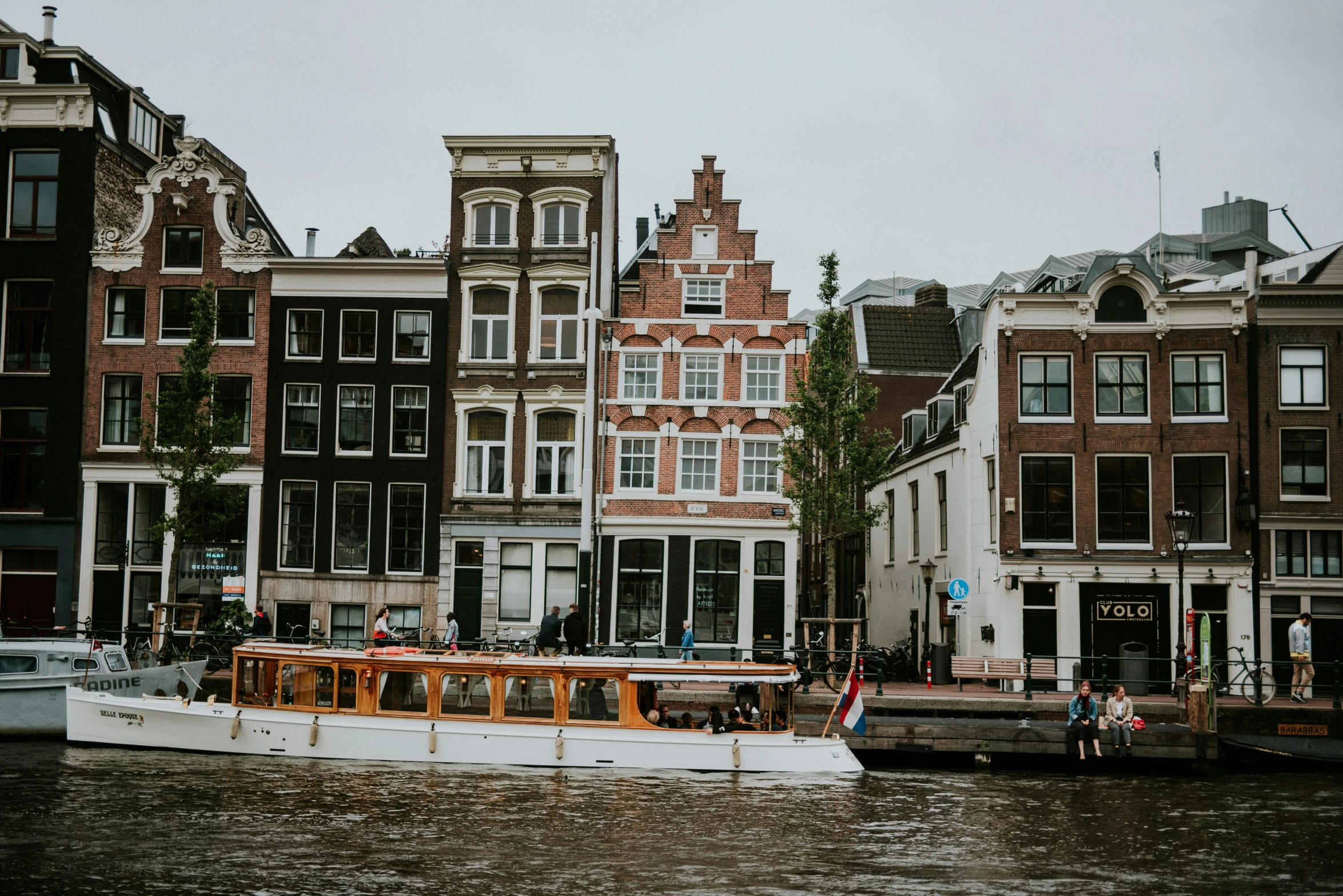 some buildings and boats on a body of water