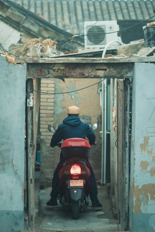 a man on a motorcycle parked in an outdoor area