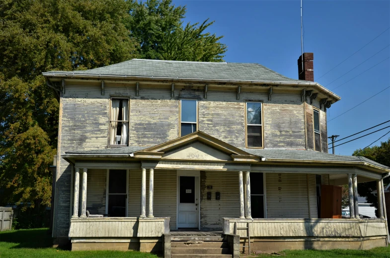 a house with large porch and many columns