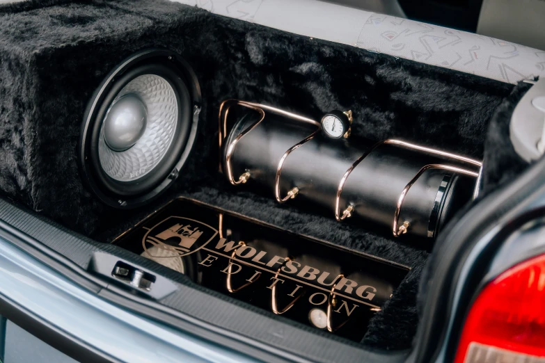 the car trunk has various speakers in it