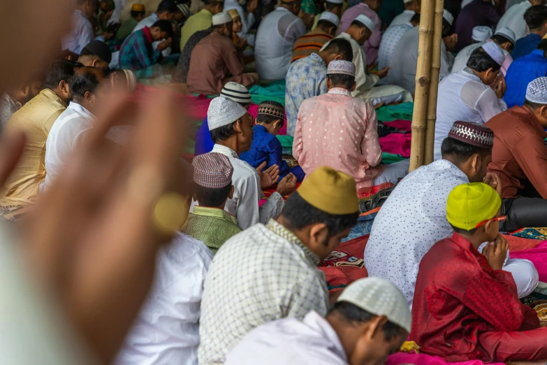 a large group of people seated and gathered together