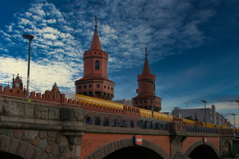 some old buildings on the side of a bridge