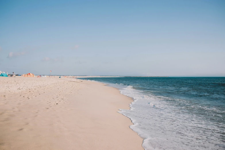 a beach near a body of water that looks like the ocean