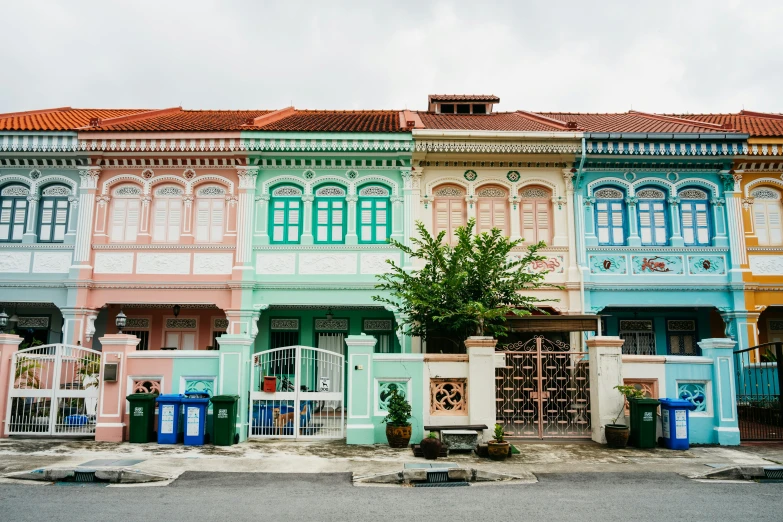 the facade of an old building that is decorated in different colors