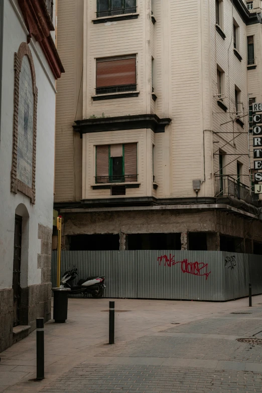 an empty street and a few buildings on the other side