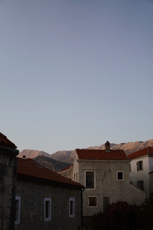 two brick buildings with the sky in background