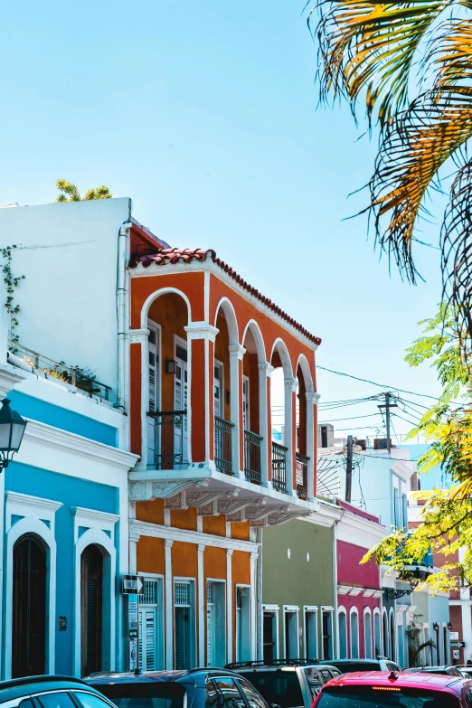 a row of colorful houses line a city street