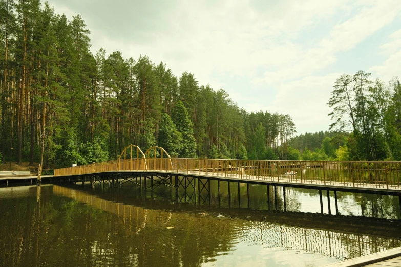 several wooden walkways leading to an empty body of water