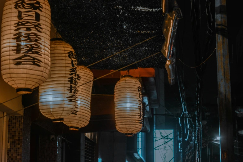 paper lanterns hanging from wires in oriental style