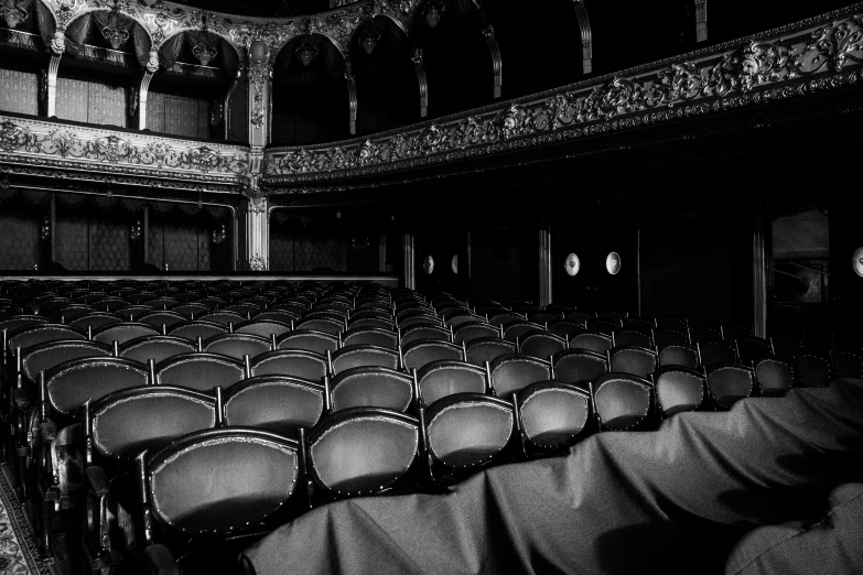 the inside of an auditorium with many empty seats