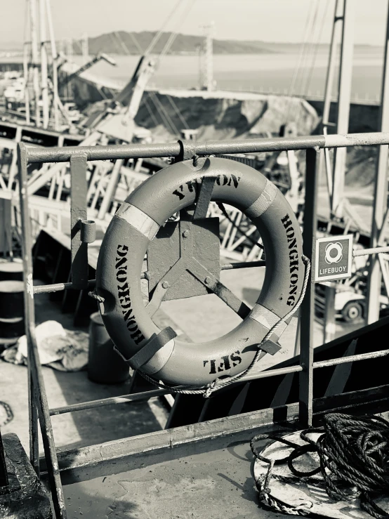 a life preserver hangs on a ship deck