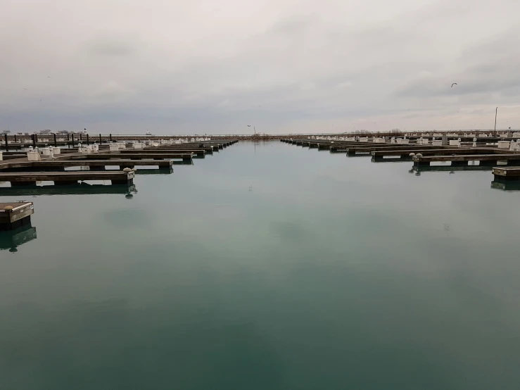 several empty docks on the water surrounded by docks