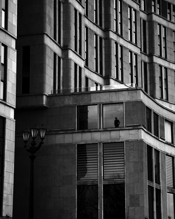 an exterior s of a modern building with shutters, on a street lamp