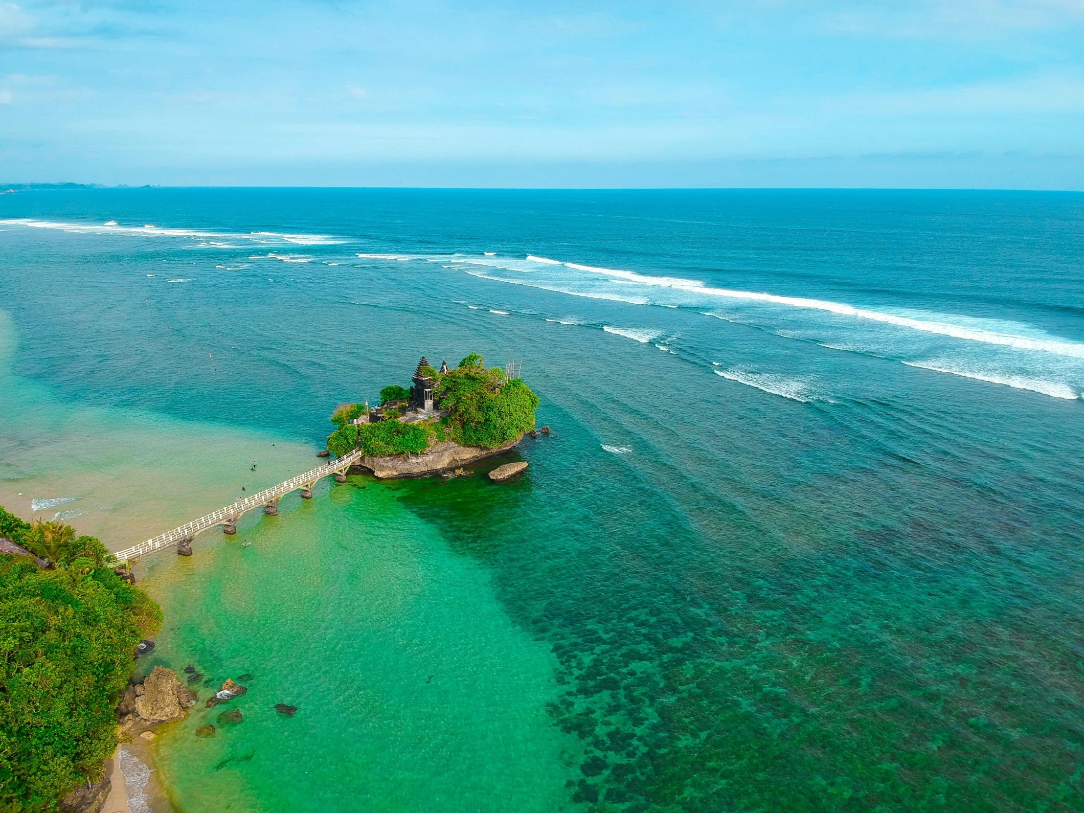 an island sits in the middle of a body of water