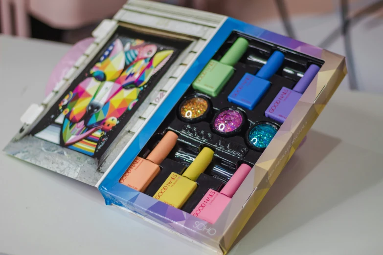 a close up of an opened box with paints