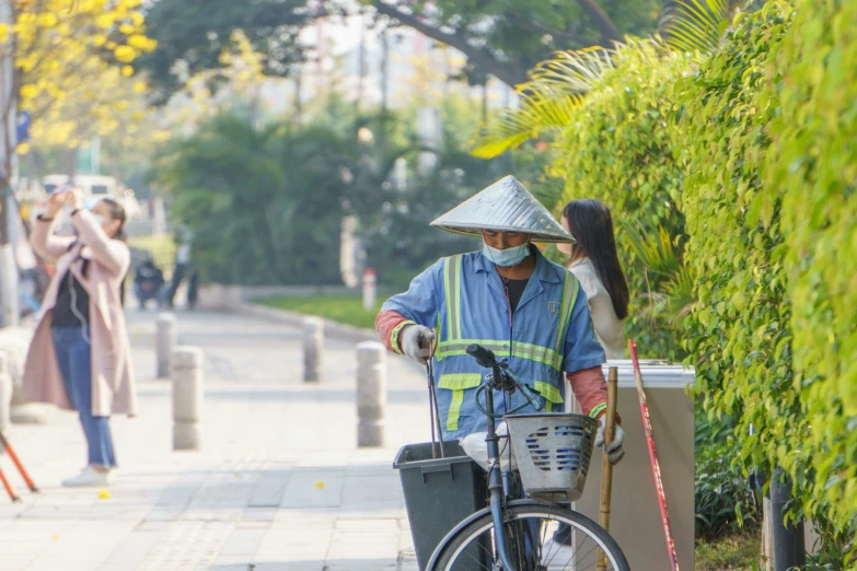 a person is carrying their bike with a helmet on