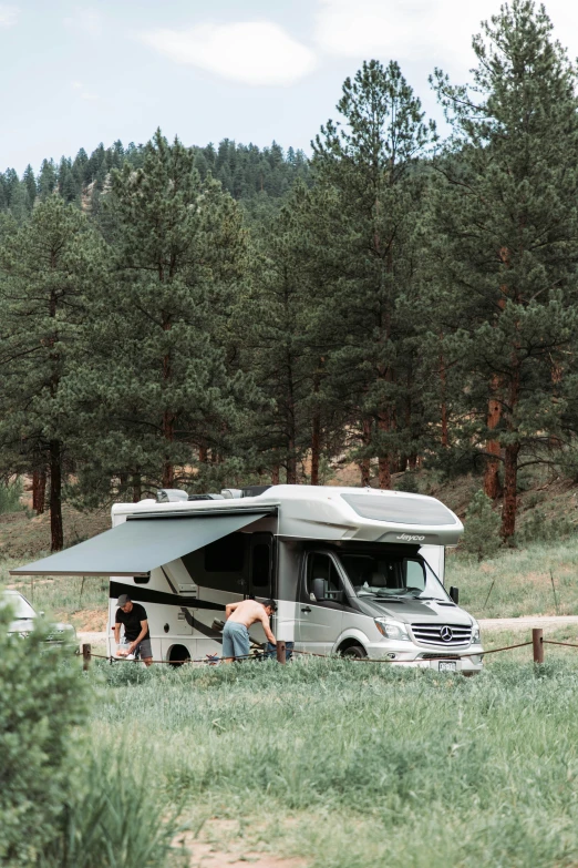 a large bus that is parked in a field