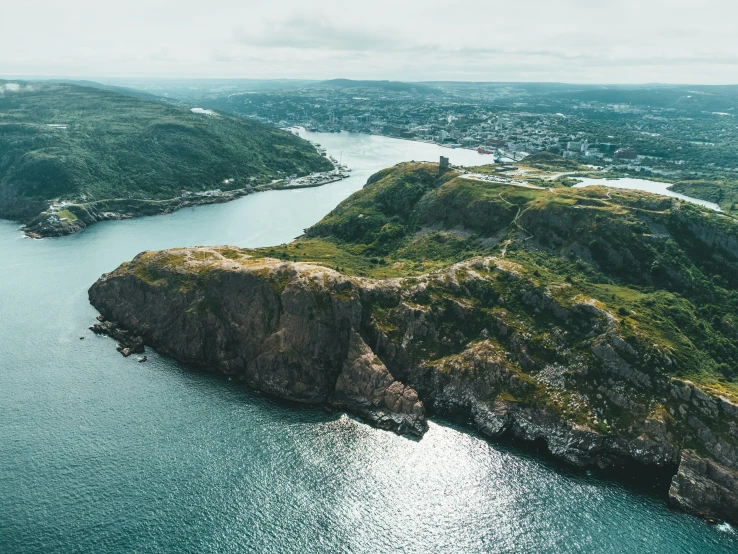 an island that is surrounded by water with lots of land