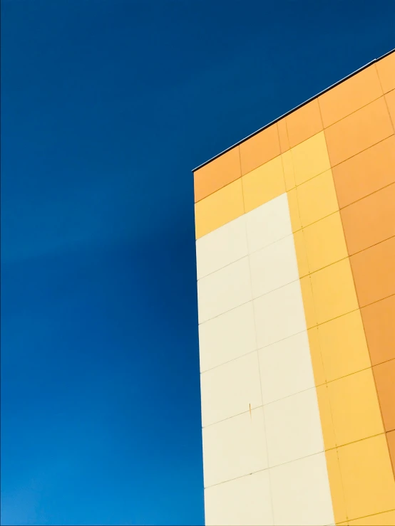 a close up of a building with blue sky in the background