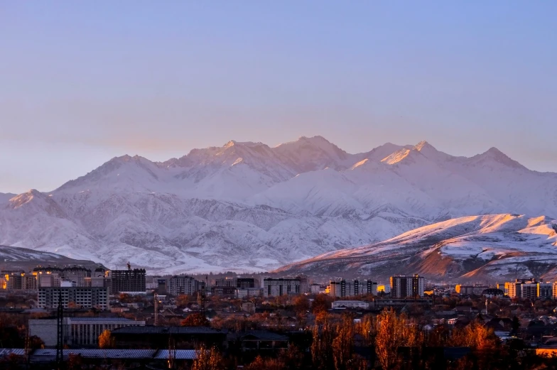 a skyline po of snow covered mountains in the distance