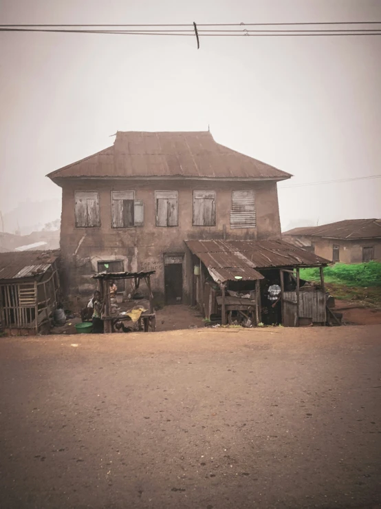 this is an old looking building in the fog