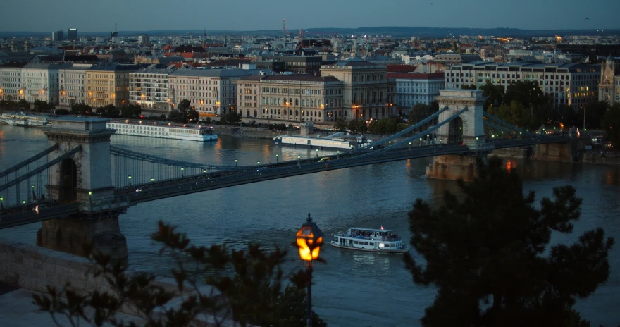 a very tall bridge that is spanning over a river