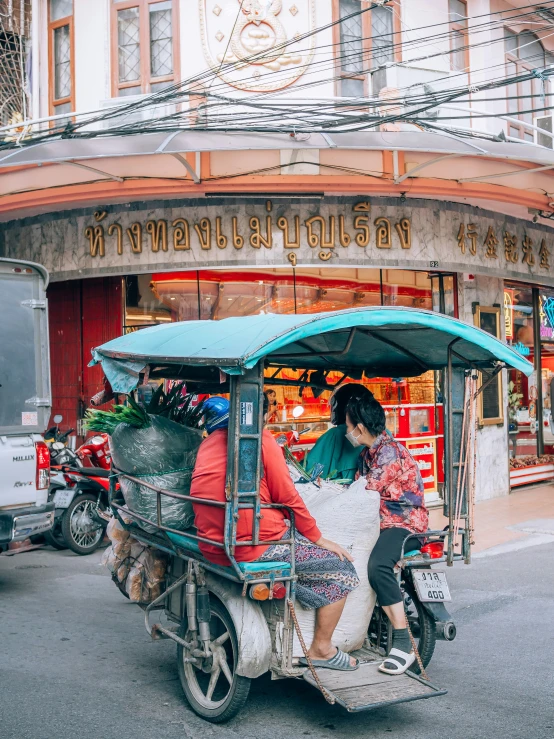 a couple on a motorcycle with bags on the back