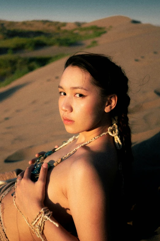 a beautiful young lady wearing native american jewelry