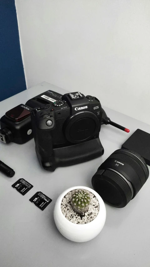 a camera and some electronics sitting on top of a table