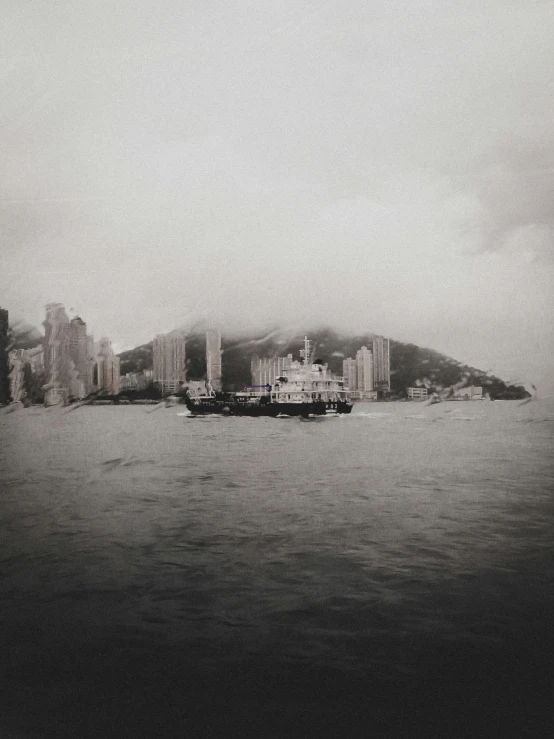 a boat sailing along side an island on a body of water