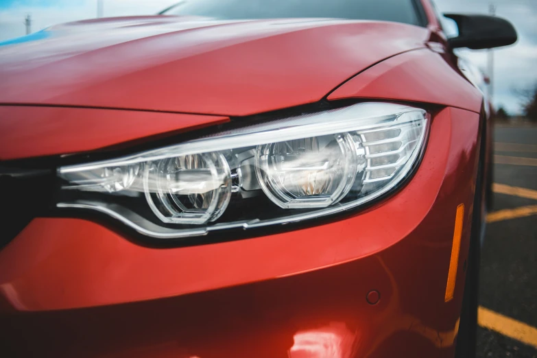 an image of a car headlight with its lights on