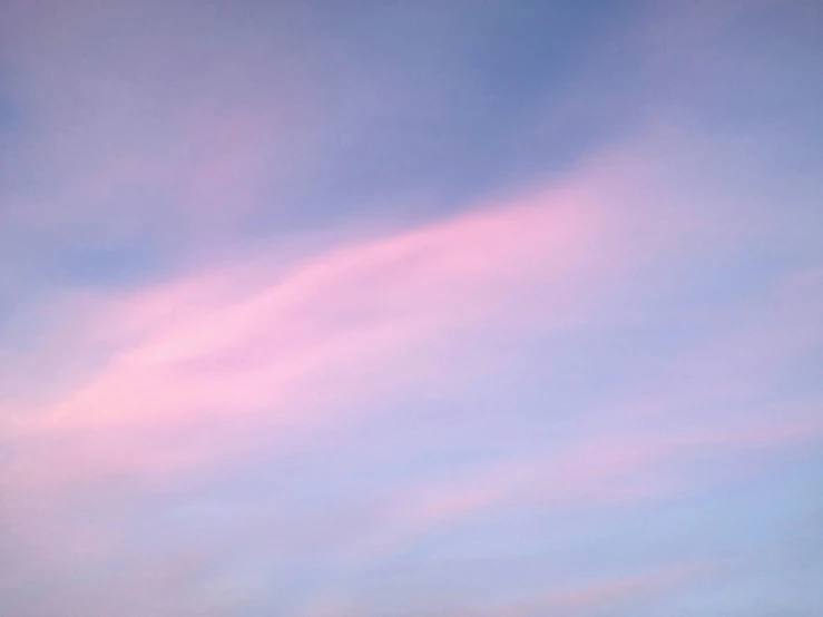 some clouds are in a blue sky and some planes