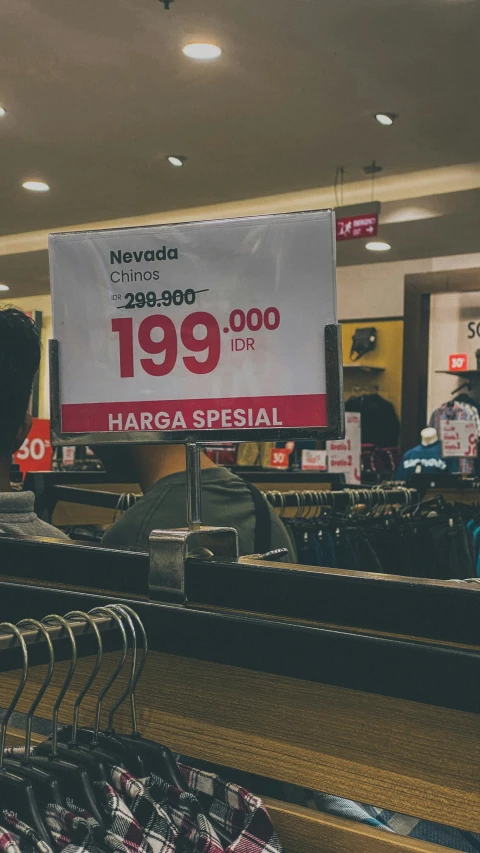 a view of the shoes and clothes on display at a store