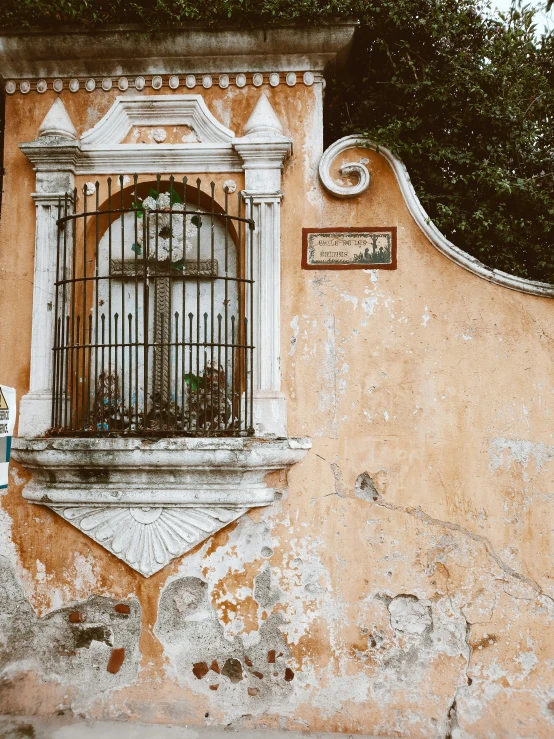 an old building has an old window that is closed