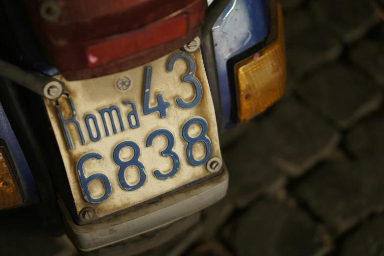 a close up of a plate that has the number of the car