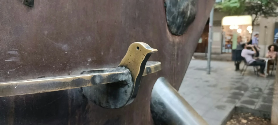 a close up of a door handle on an open door