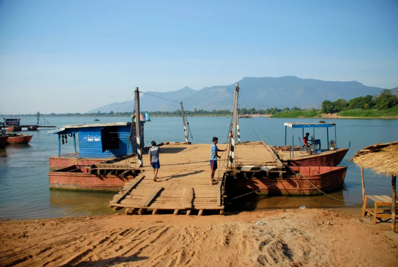 some people that are standing on a boat