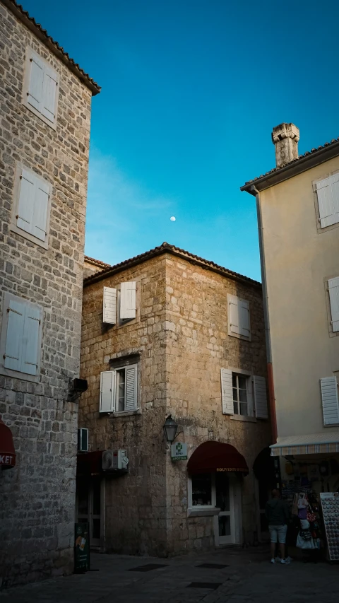 buildings on a street with a sky background