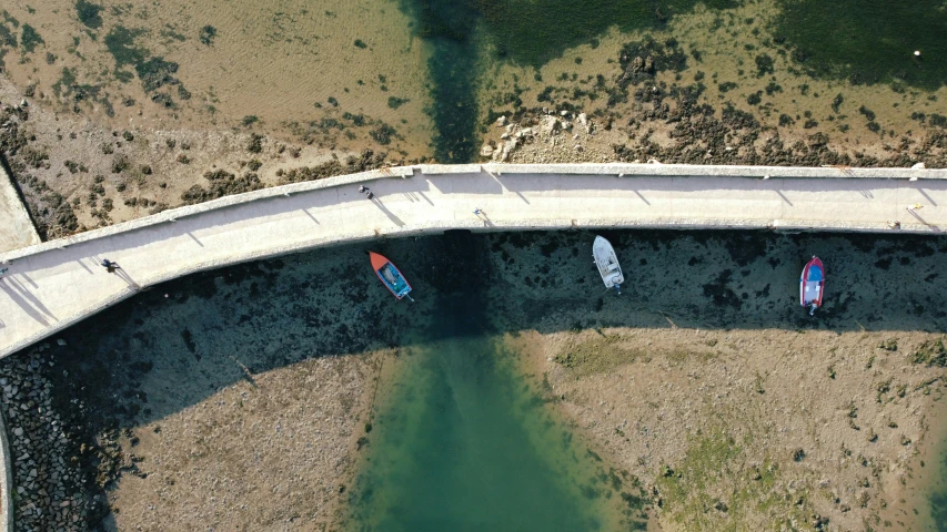 the three canoes are in one waterway between the two streets