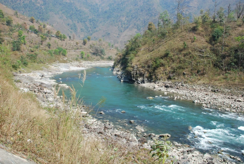 the river is running through the rocky terrain