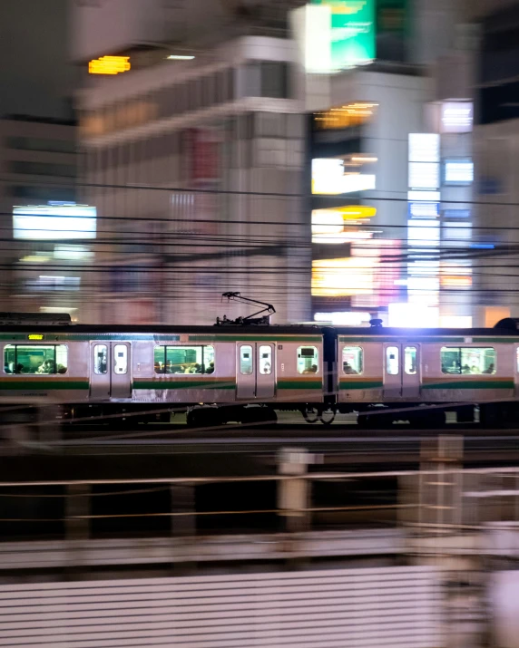 a subway train is traveling through a busy city
