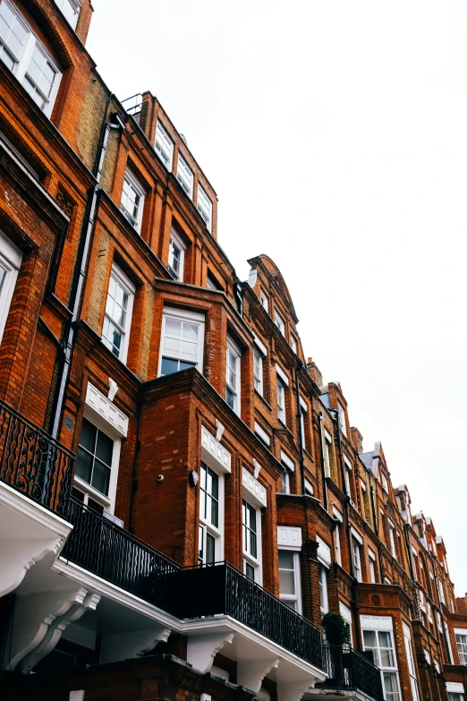 a street view with many buildings and several different balconies