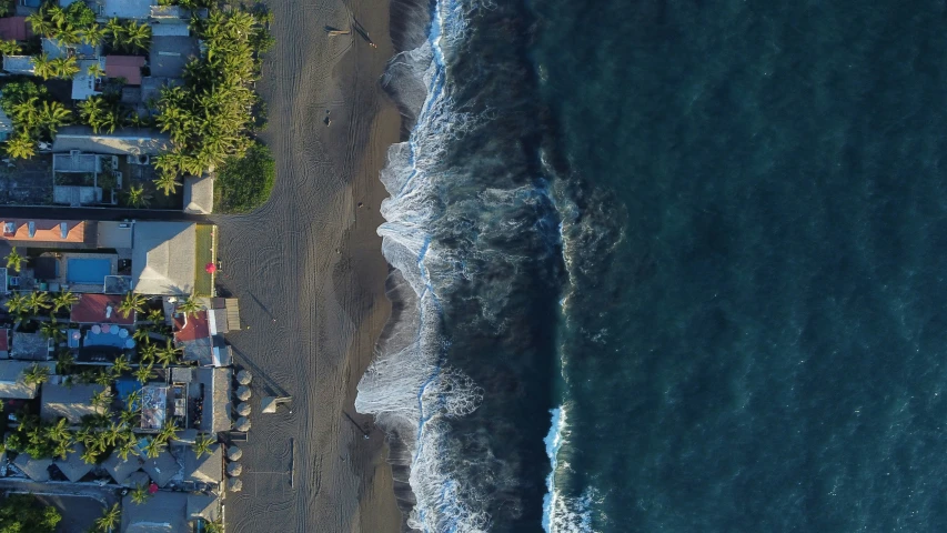 this is an aerial view of some houses near the beach