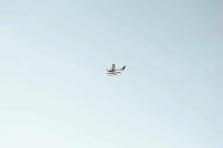 an airplane flying in the clear blue sky