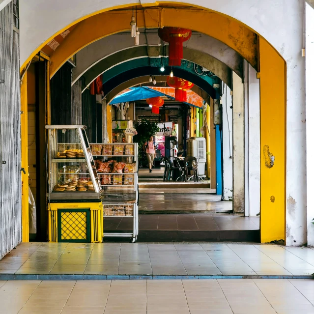 an archway that leads to a street market