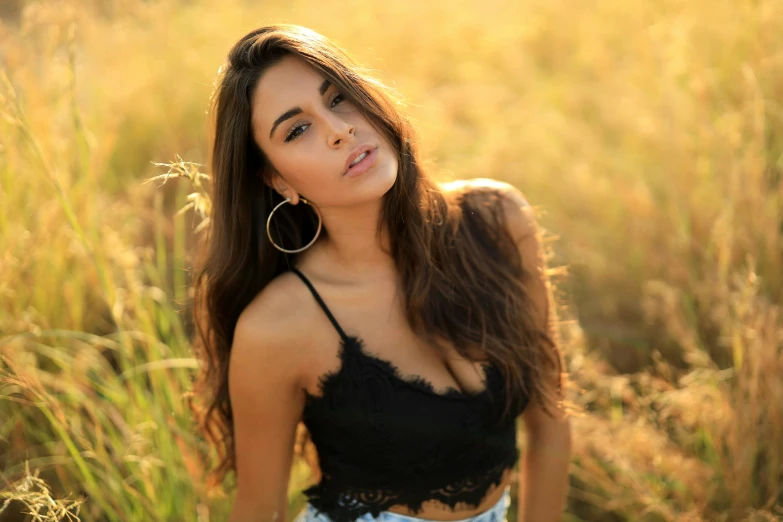 a girl posing for a po in a field