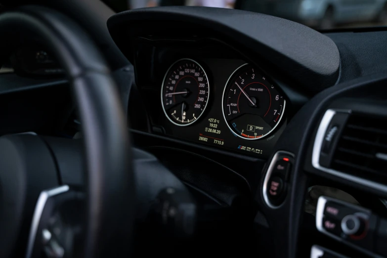 the dashboard of a car with two gauges