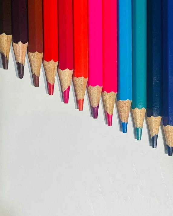 pencils lined up with various colors in them