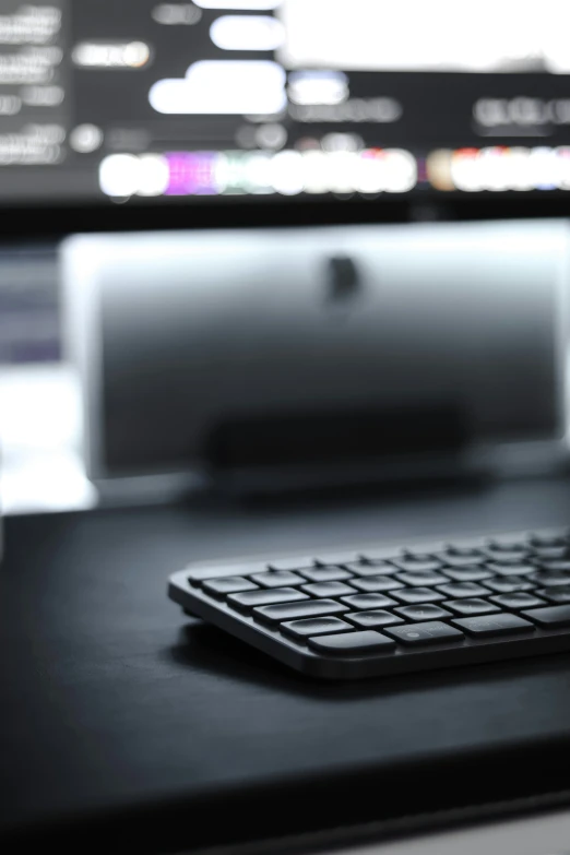 the keyboard is on the table near the television